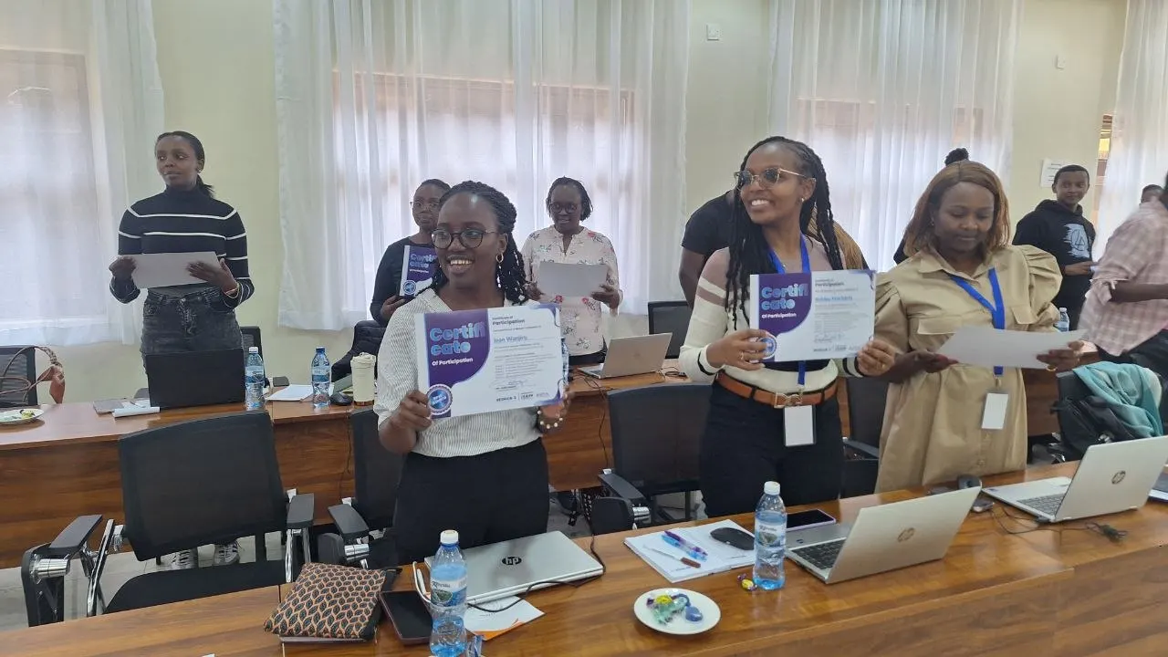 Participants holding certificates of participation after a four-day Resmob Solutions course on using AI for resource mobilization in Kenya